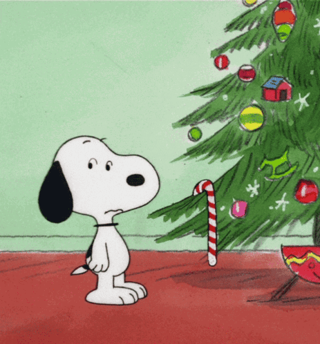 Snoopy takes a candy cane off of a Christmas tree then dances
